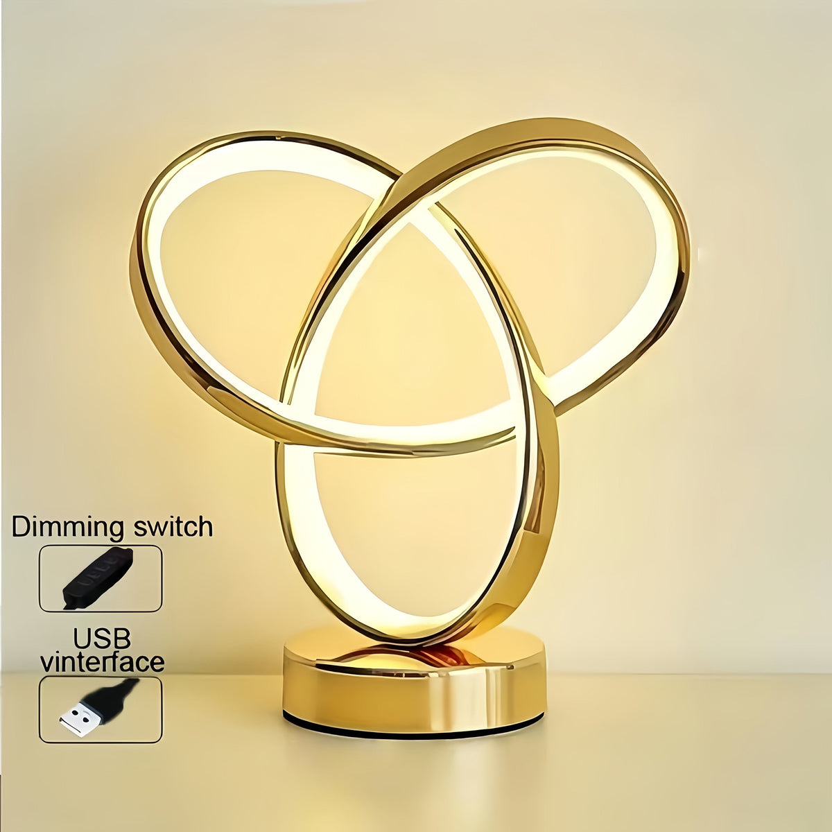 Lámpara de escritorio LED con anillo Möbius de metal encendida sobre un escritorio — 4USelects