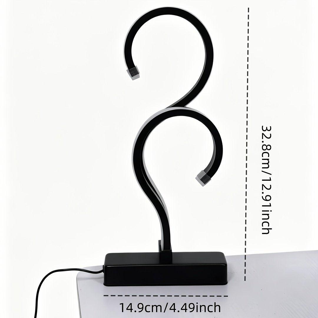 Lámpara de Mesa LED Espiral Signo Interrogación vista frontal con la luz cálida encendida