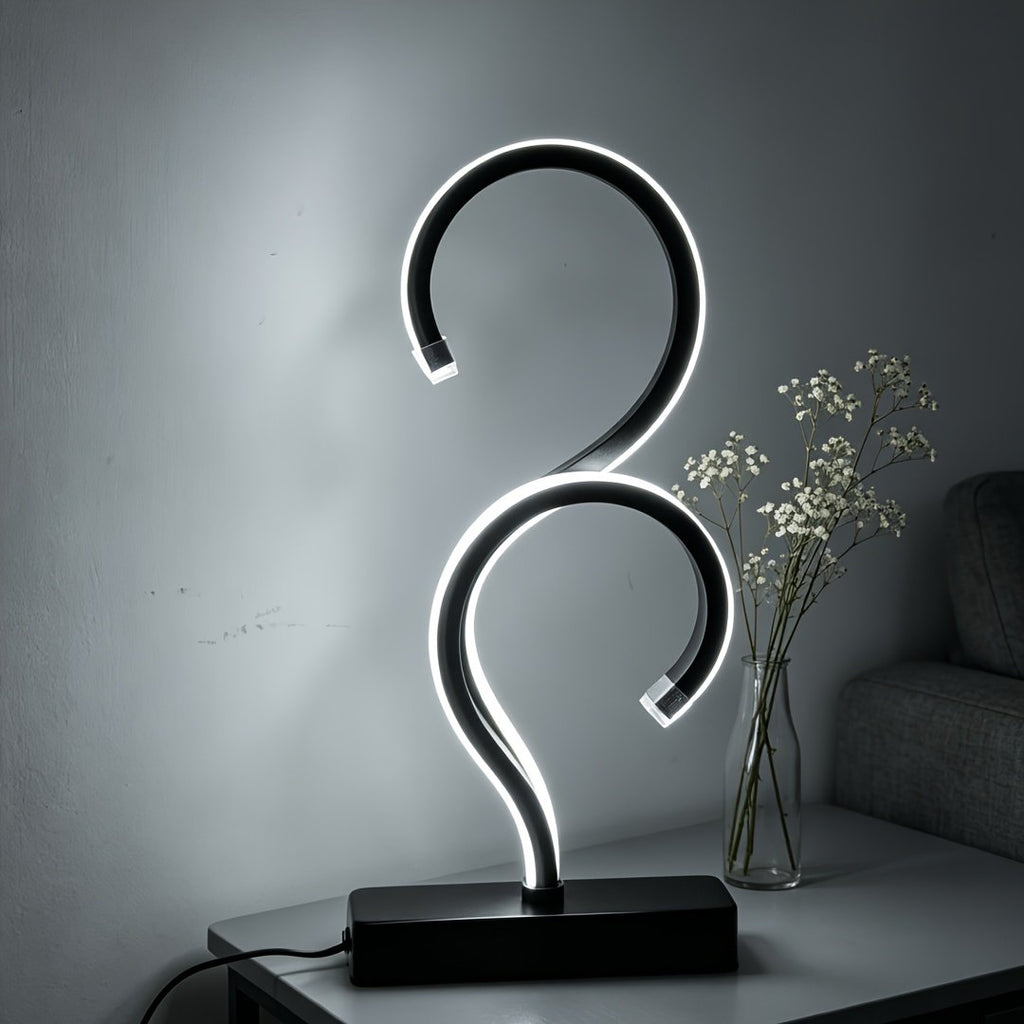 Lámpara de Mesa LED Espiral Signo Interrogación apagada sobre un buró junto a la cama