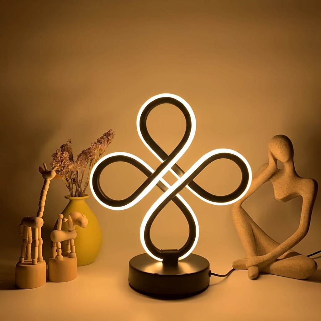 Lámpara de Escritorio LED Aluminio Nudo Chino vista frontal con la luz cálida encendida
