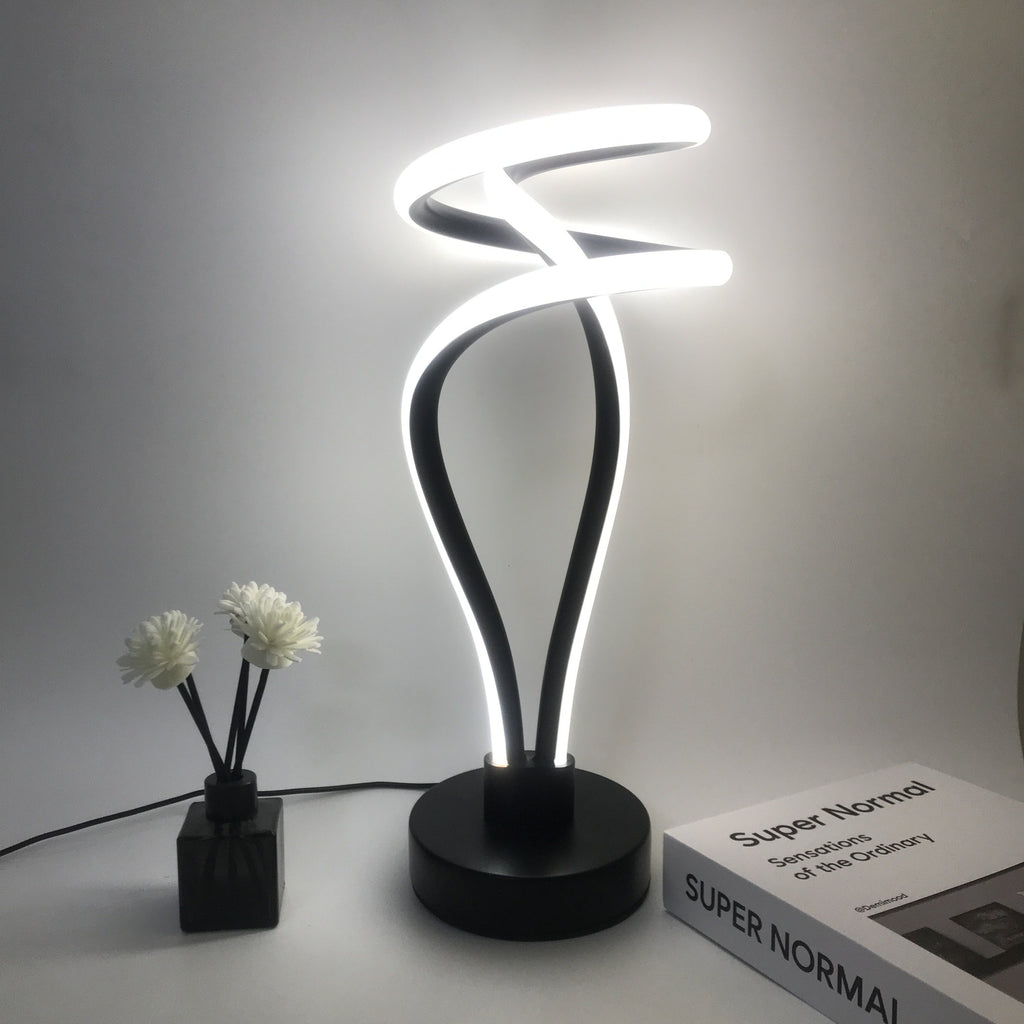 Lámpara de Escritorio LED Cloud Top USB Regulable apagada sobre un buró junto a la cama