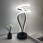 Lámpara de Escritorio LED Cloud Top USB Regulable apagada sobre un buró junto a la cama