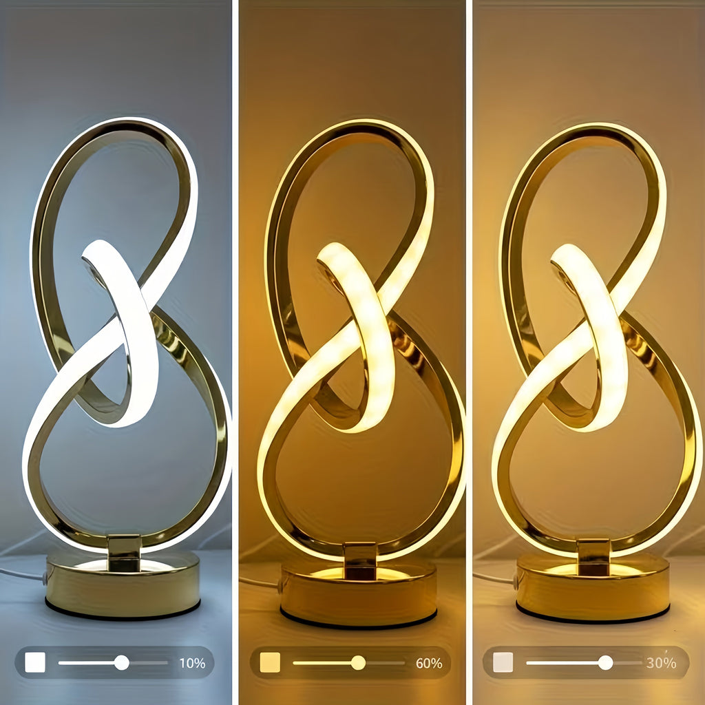 Lámpara de Escritorio Espiral USB Negra y Dorada encendida sobre un escritorio de madera