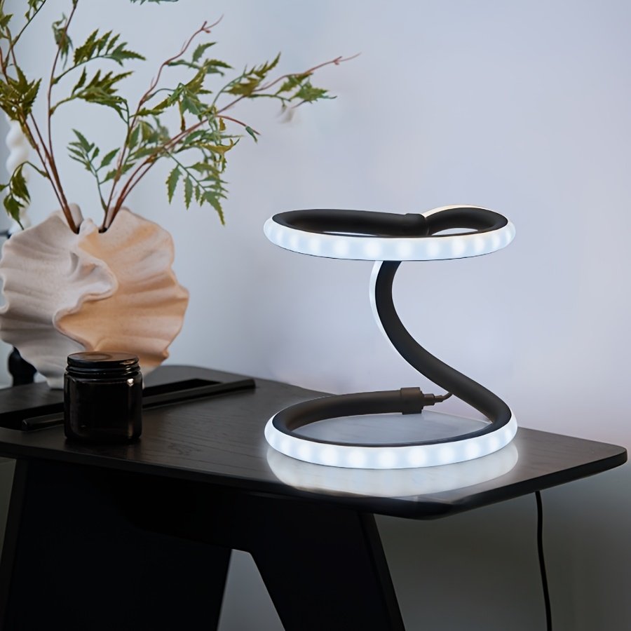 Lámpara de Mesa LED Doble Anillo Infinito Dorada vista frontal con la luz cálida encendida