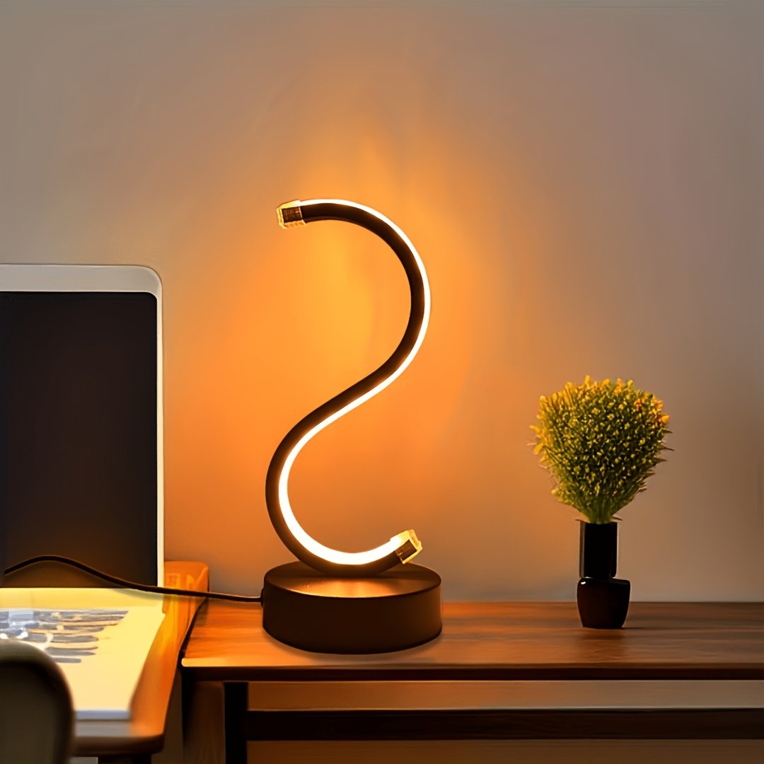 Lámpara de Mesa LED Curva en S Luz Cálida vista frontal con la luz cálida encendida